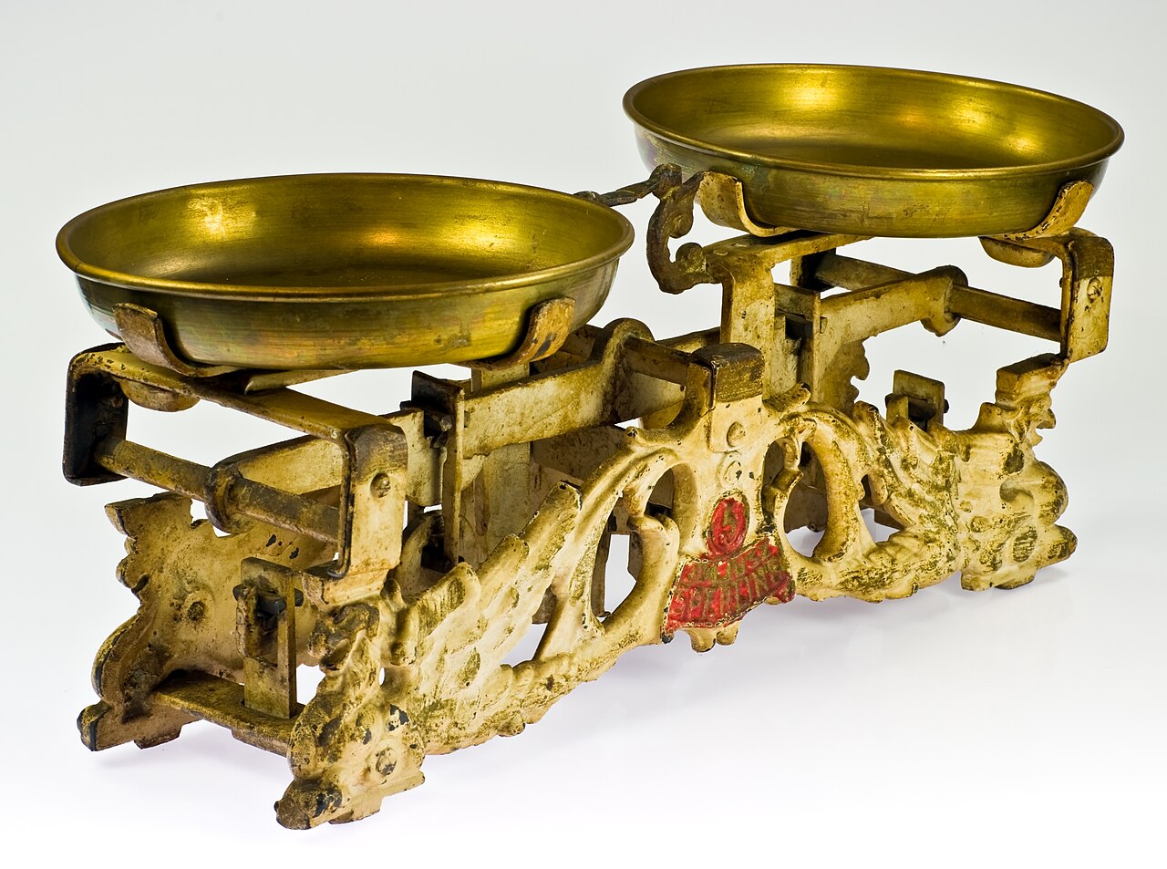 Vintage brass balance scale with two suspended pans